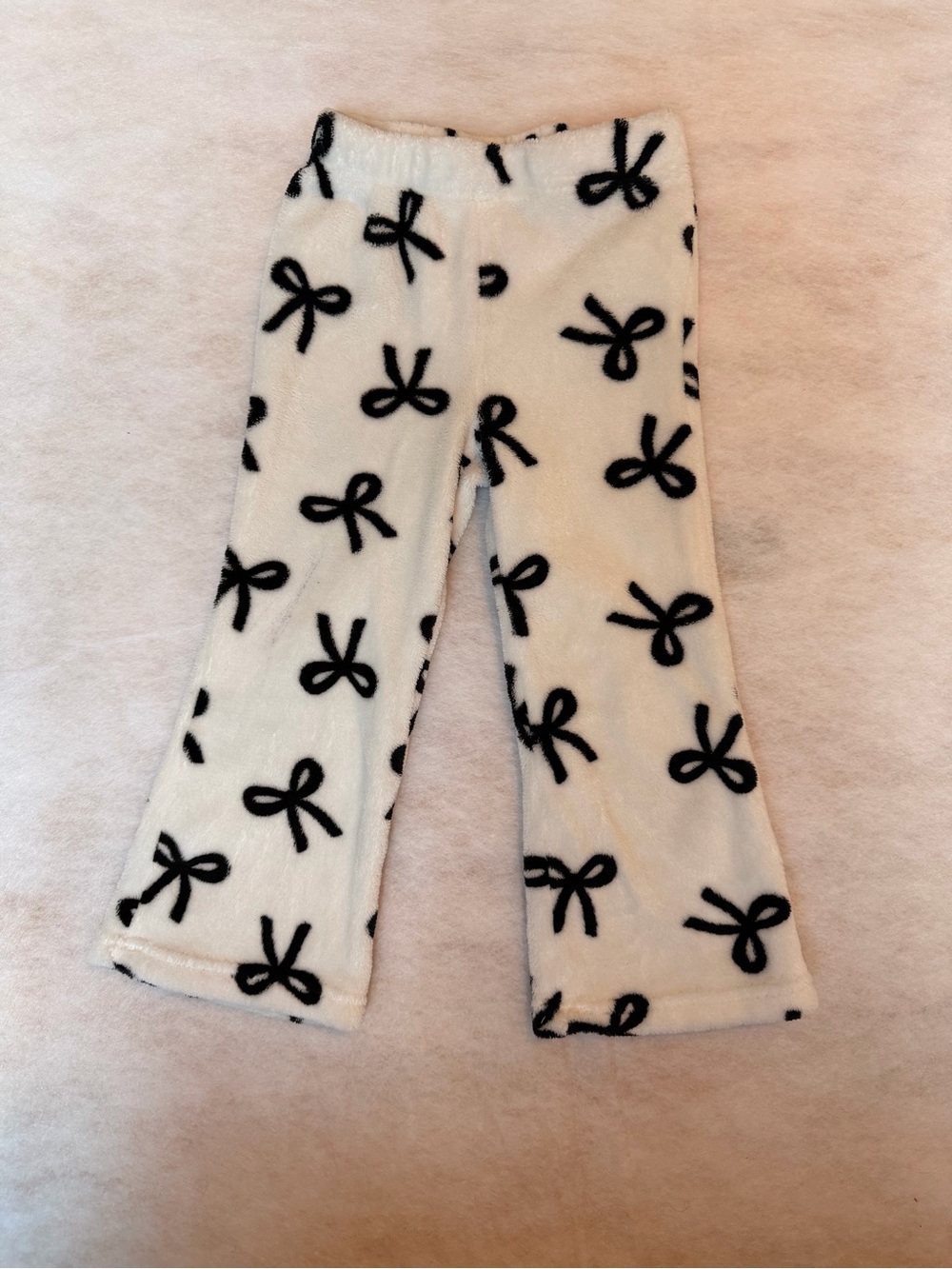 Cozy White Fuzzy Pants with Black Bow Print